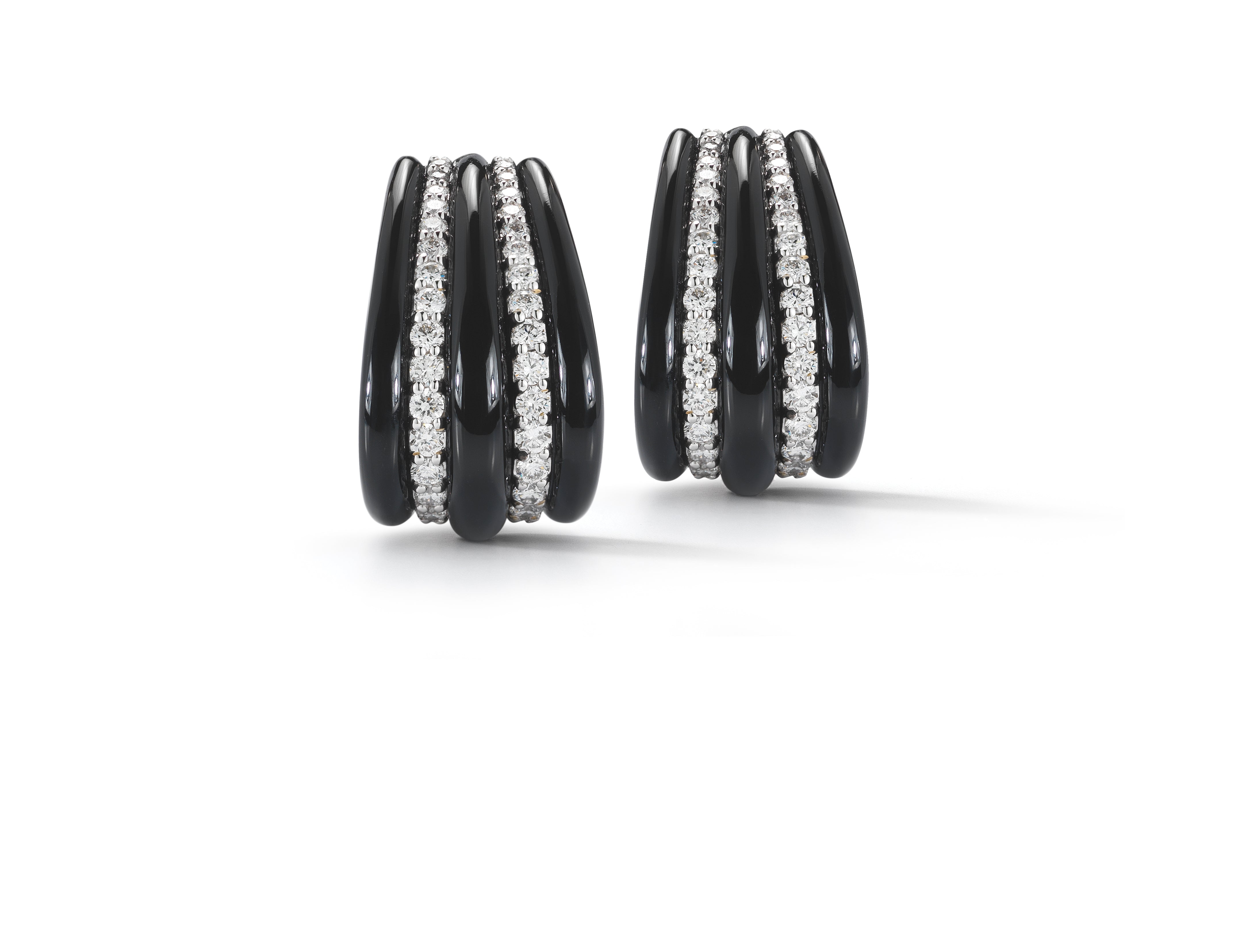 A pair of Hoop Earrings in Black Onyx with Diamond Accents Set in 18K White Gold. Signed Seaman Schepps.