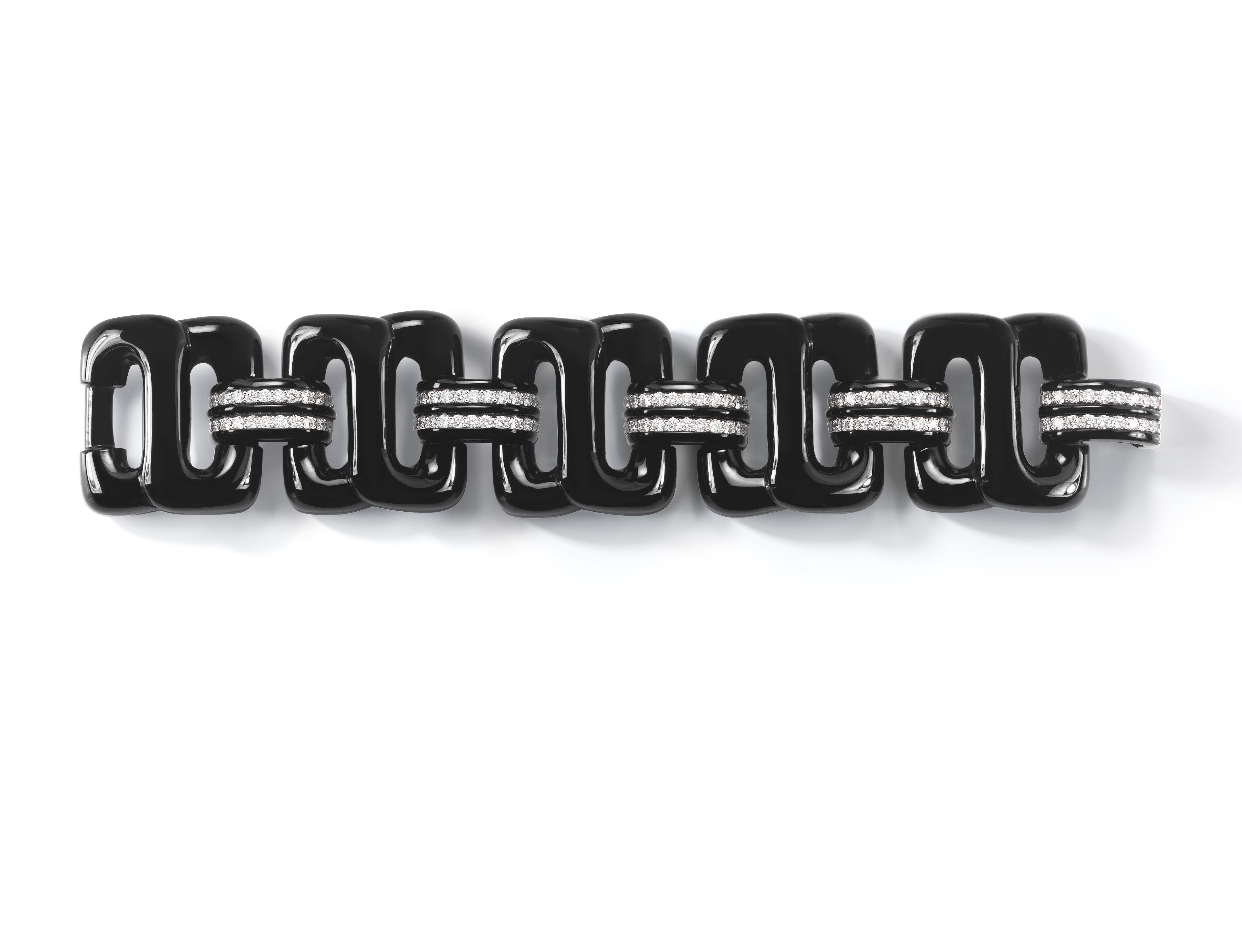 A Buckle Bracelet in Black Onyx and Diamond set in 18K White Gold. Signed Seaman Schepps.
