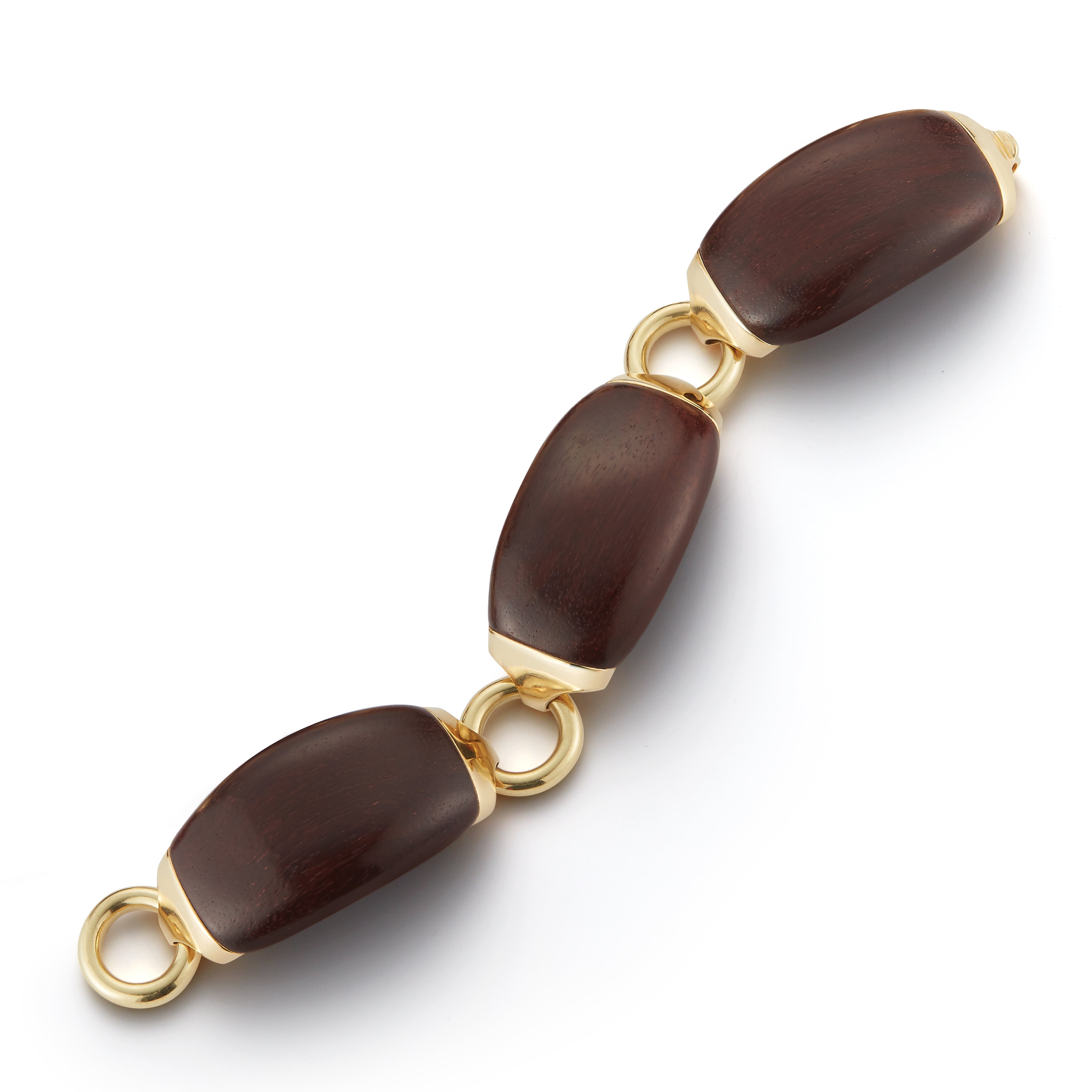 A Boat Link Bracelet in Rosewood and 18K Yellow Gold. Signed Seaman Schepps.