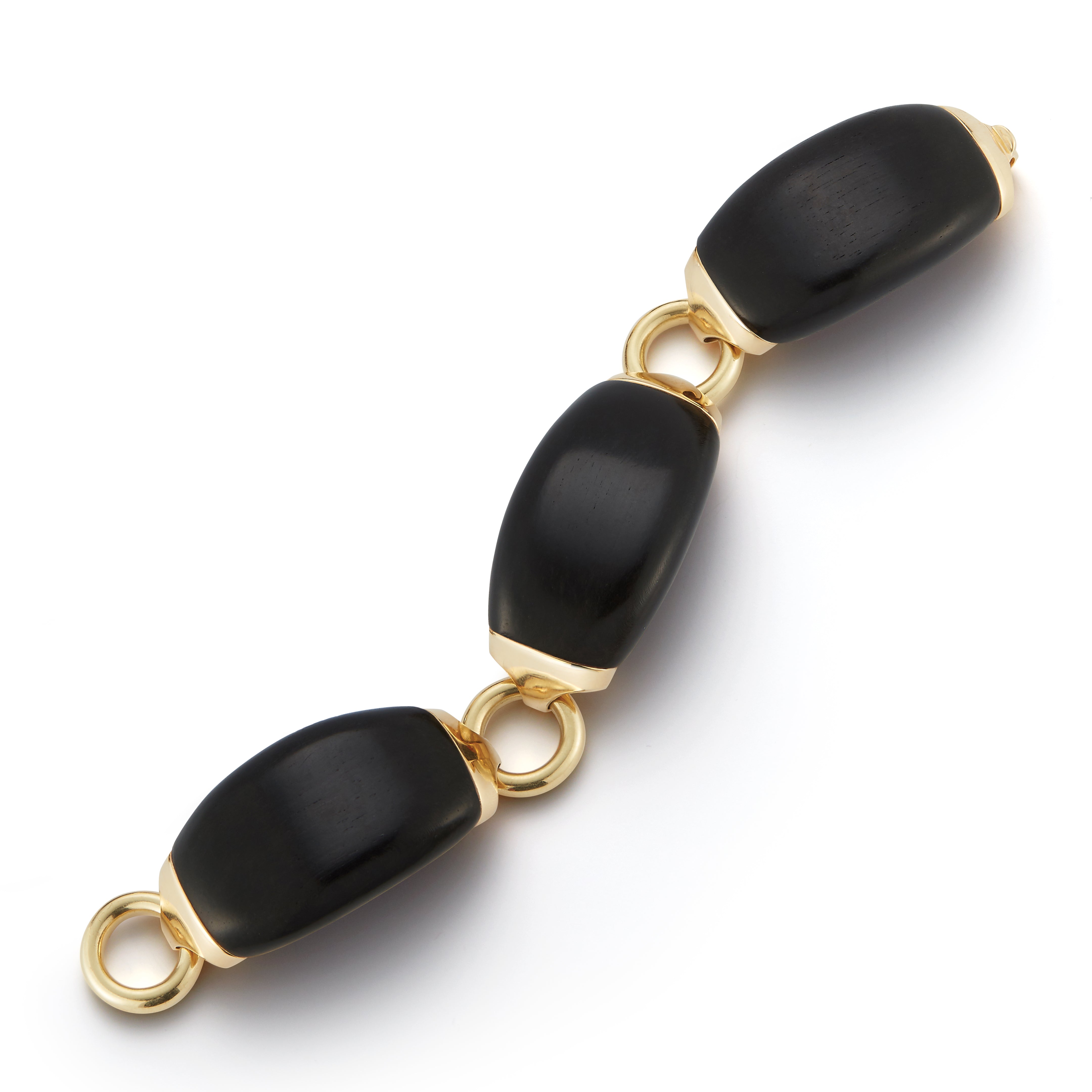 A Boat Link Bracelet in Ebony Wood and 18K Yellow Gold. Signed Seaman Schepps.